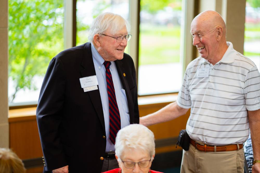 President Emeritus Don Lubbers talking with guests at the Retiree Reception.